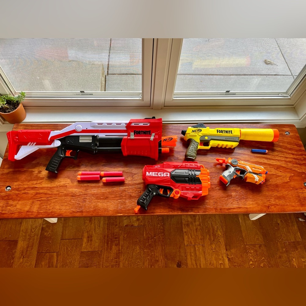 4 Nerf guns. 2 Fortnite. 2 regular. Includes 7 large bullets & 5 regular bullets